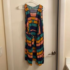 dress with pleated, tie front; above knee length